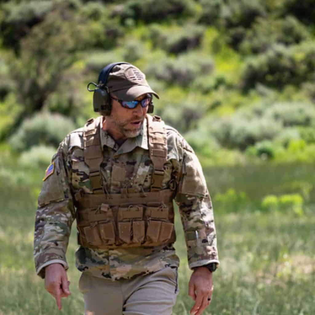 Jeff Tiegs, Face Off host, in camouflage and a plate carrier on a field course
